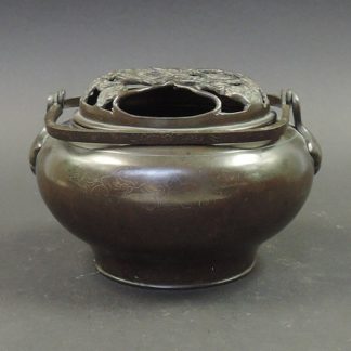 Qing bronze handwarmer | Bovens Amsterdam